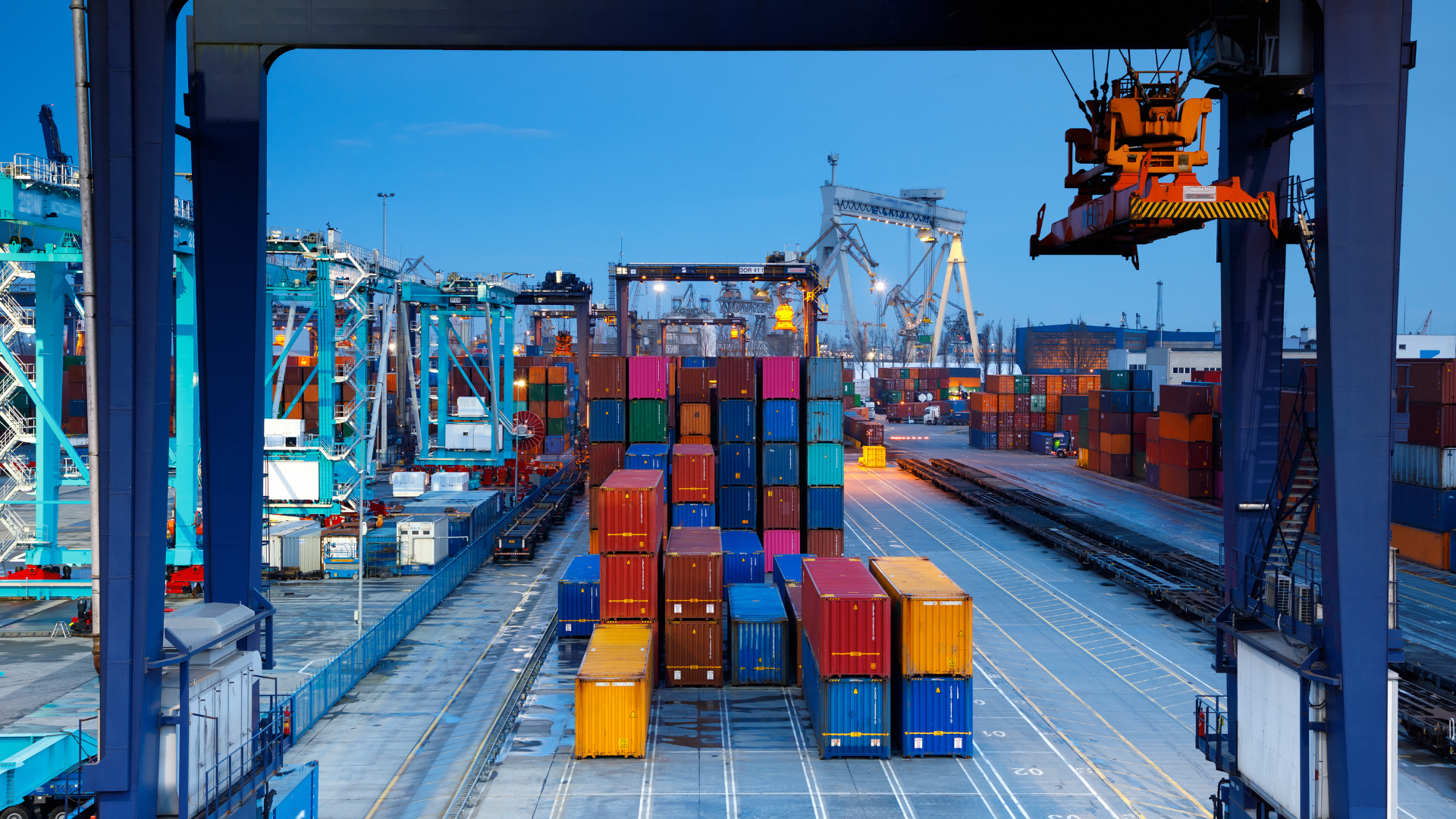 Container terminal and cargo cranes at dusk